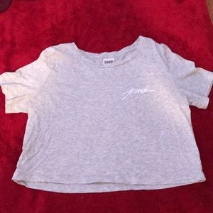 A grey crop top from pink